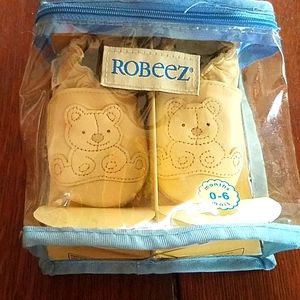 Robeez 0-6 month baby slippers.